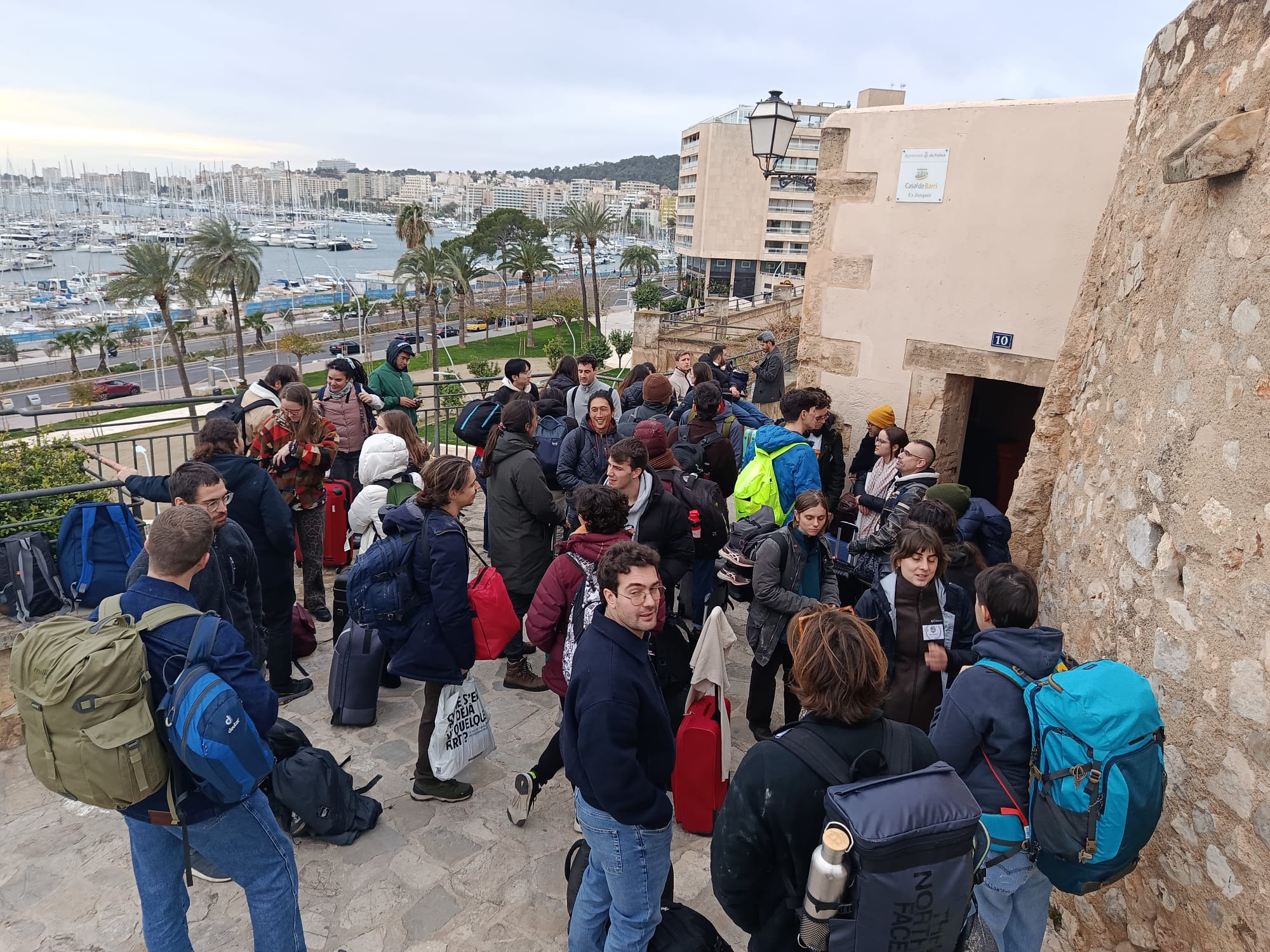 Picture at the door of the welcoming event, in Casal de Barri Es Jonquet